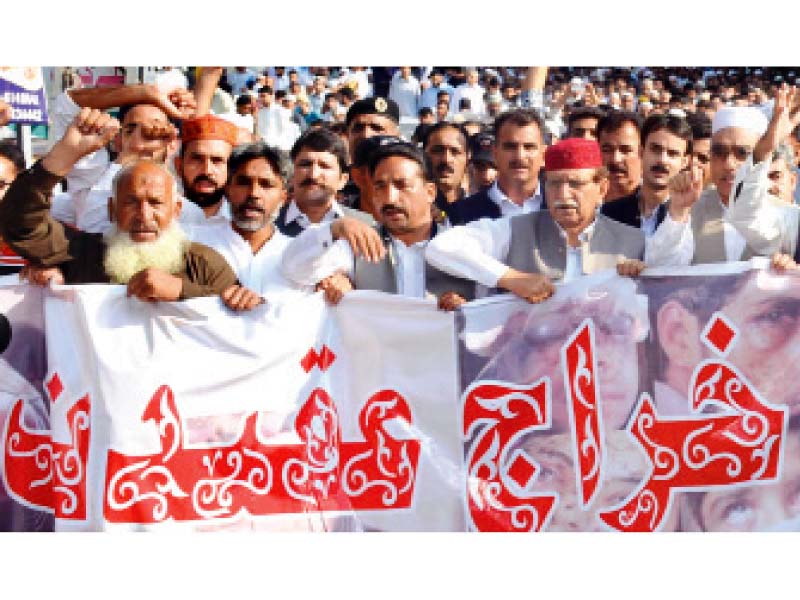 The AJK prime minister leading protesters during the march. PHOTO: EXPRESS