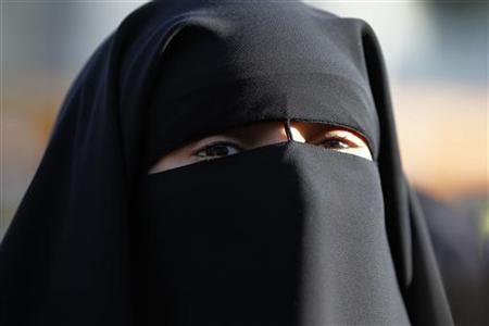 Hind Ahmas wears a niqab despite a nationwide ban on the Islamic face veil outside the courts where she arrived with the intention to pay a fine after she was arrested last May for wearing the niqab in public, in Meaux, east of Paris. PHOTO: REUTERS