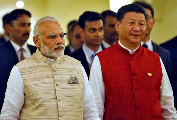 Indian Prime Minister Narendra Modi (L) and Chinese President Xi Jinping  arrive for a photo opportunity ahead of BRICS (Brazil, Russia, India, China and South Africa) Summit in Benaulim, in the western state of Goa, India, October 15, 2016. PHOTO: REUTERS