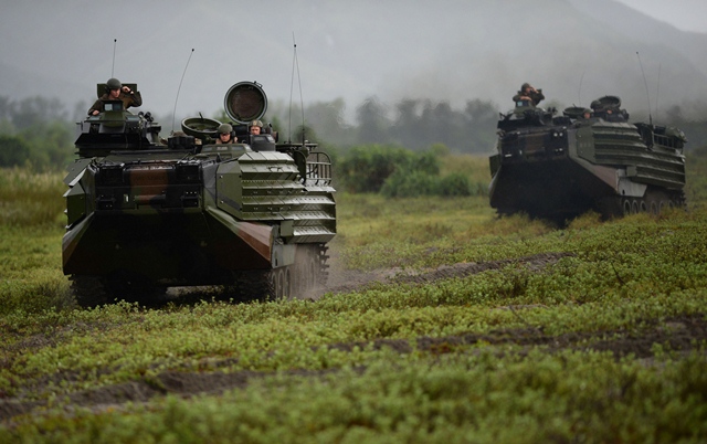 US marines amphibious assault vehicles (AAV) taking part in the US-Philippines joint annual beach landing exercise on the shores facing the South China Sea in San Antonio town, Zambales province, north of Manila. PHOTO: AFP