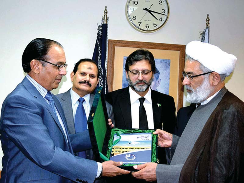 NAB chairman Qamar Zaman Chaudhry presents a memento to Iran’s Attorney General Syed Jafer Montazeri. PHOTO: APP