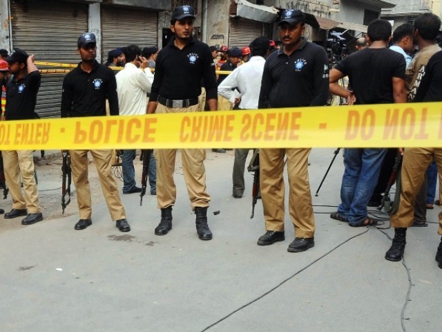 Unidentified motorcyclists opened fire on the professor's car, killing him instantly. PHOTO: AFP
