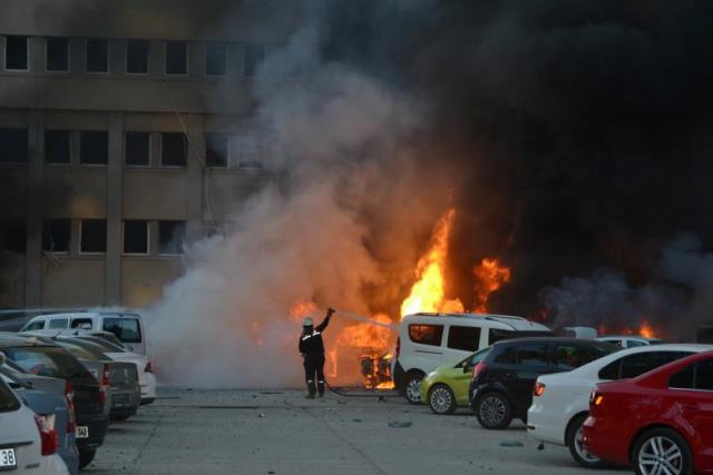 A firefighter tries to extinguish burning vehicles after an explosion outside the governor's office in the southern city of Adana, Turkey, November 24, 2016. Ihlas News PHOTO: REUTERS