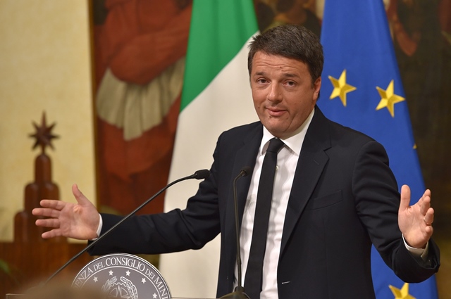 Italy's Prime Minister Matteo Renzi announces his resignation during a press conference at the Palazzo Chigi following the results of the vote for a referendum on constitutional reforms, on December 4, 2016 in Rome. PHOTO: AFP