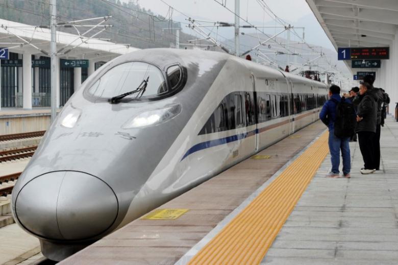 A high-speed railway train linking Shanghai and Kunming, of Yunnan province, is seen at a station during a partial operation, in Anshun, Guizhou province, China
PHOTO: REUTERS