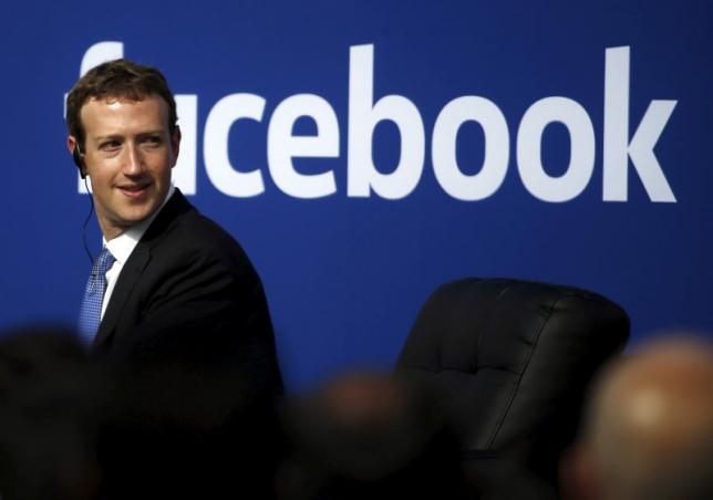 Facebook CEO Mark Zuckerberg is seen on stage during a town hall at Facebook's headquarters. PHOTO: REUTERS