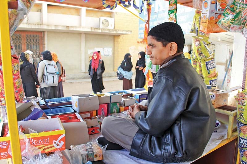 Muhammad Faizan Paracha has set up a small tuck shop, ‘Crunchy Munchy’, under the building of the social work department at the University of Karachi. PHOTO: AYESHA MIR/EXPRESS