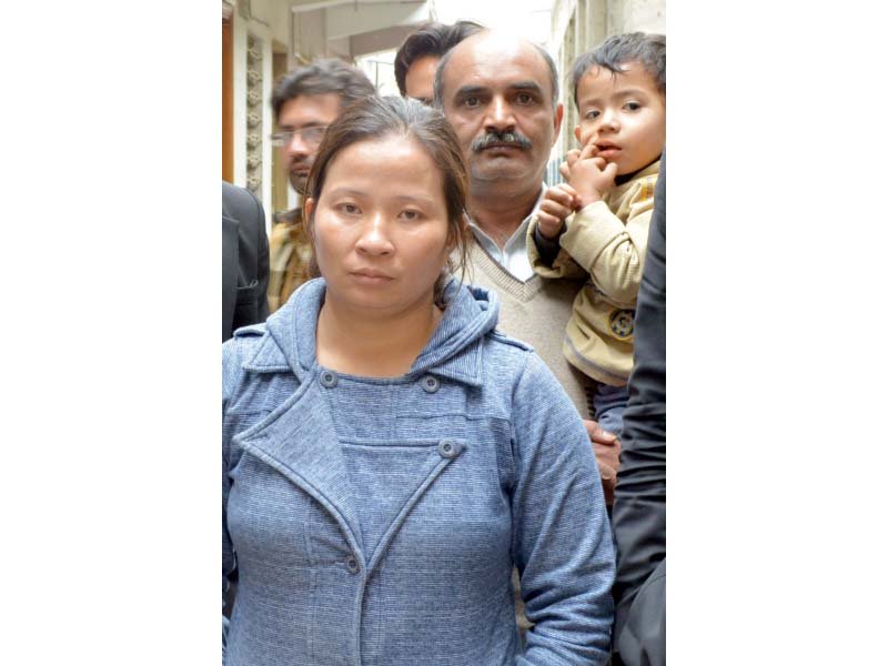 Chen Yen arrives to appear in court. PHOTO: ZAFAR ASLAM/EXPRESS