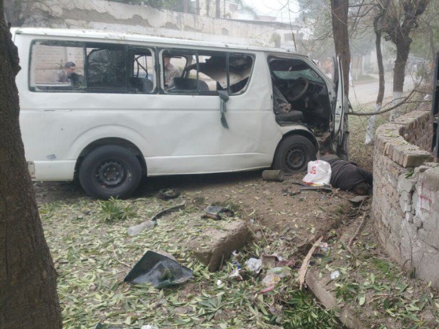 The blast targeted a government van (A-5597), while it was on its way to Judges Colony in the Hayatabad, Peshawar. PHOTO: IFTIKHAR FIRDOUS/EXPRSS