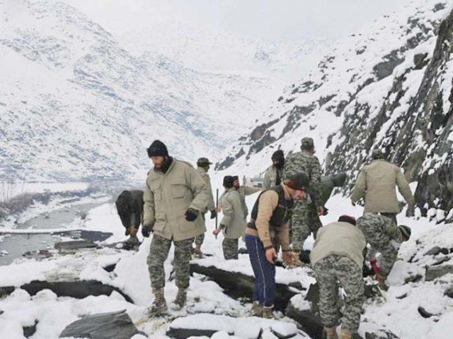 Chitral Scouts conduct a rescue operation in an avalanche-hit area. PHOTO: INP