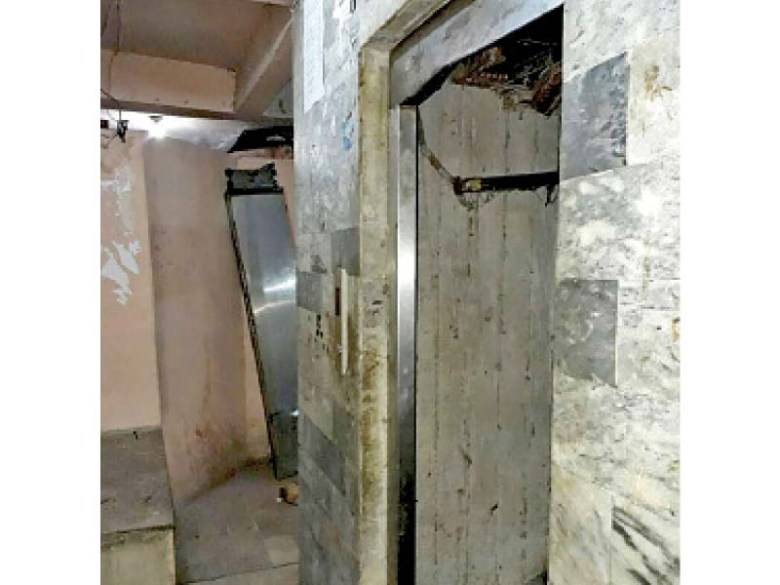 The cabin of the elevator had to be cut to rescue the man stuck between the two floors. PHOTO: EXPRESS