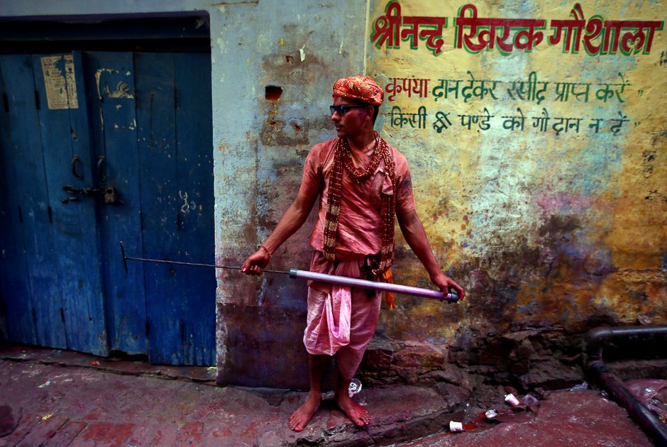 A Hindu devotee holds a water gun as he takes part in the religious festival of Holi in Nandgaon village, in the state of Uttar Pradesh, India. PHOTO: REUTERS