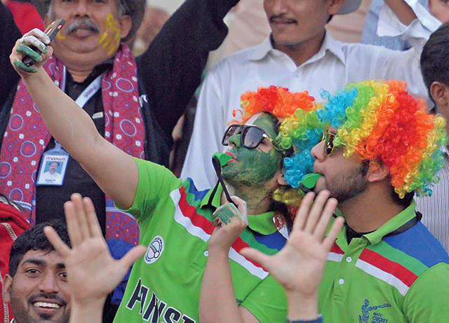 Fans take a selfie during the final match of PSL 2017. PHOTO: AFP