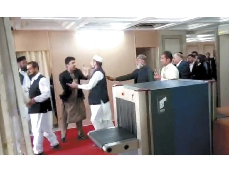 Fellow MPs try to stop PTI’s Murad Saeed during a scuffle with PML-N’s Javed Latif. PHOTO: INP