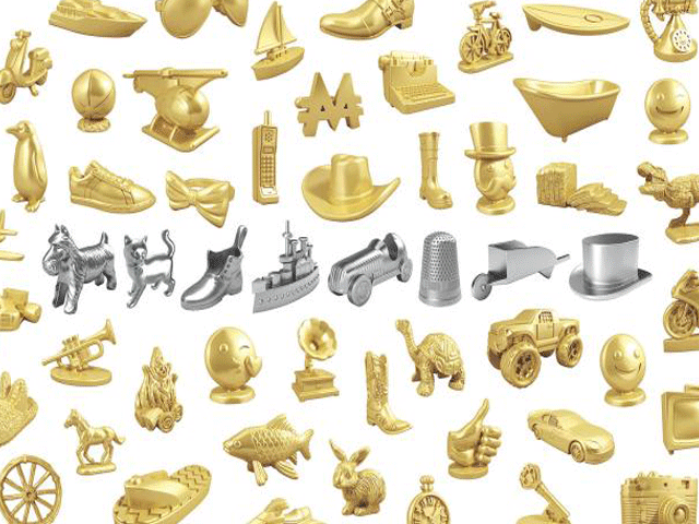 The eight current Monopoly tokens are surrounded by tokens being voted on for inclusion to the board game. PHOTO: REUTERS