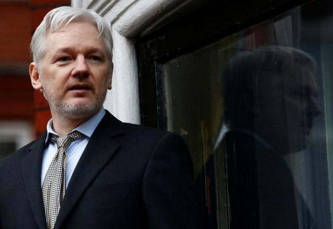 WikiLeaks founder Julian Assange makes a speech from the balcony of the Ecuadorian Embassy, in central London.   
PHOTO: REUTERS