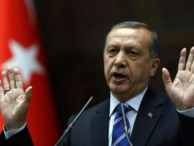 Turkey's Prime Minister Tayyip Erdogan addresses members of parliament from his ruling AK Party (AKP) during a meeting at the Turkish parliament. PHOTO: REUTERS.