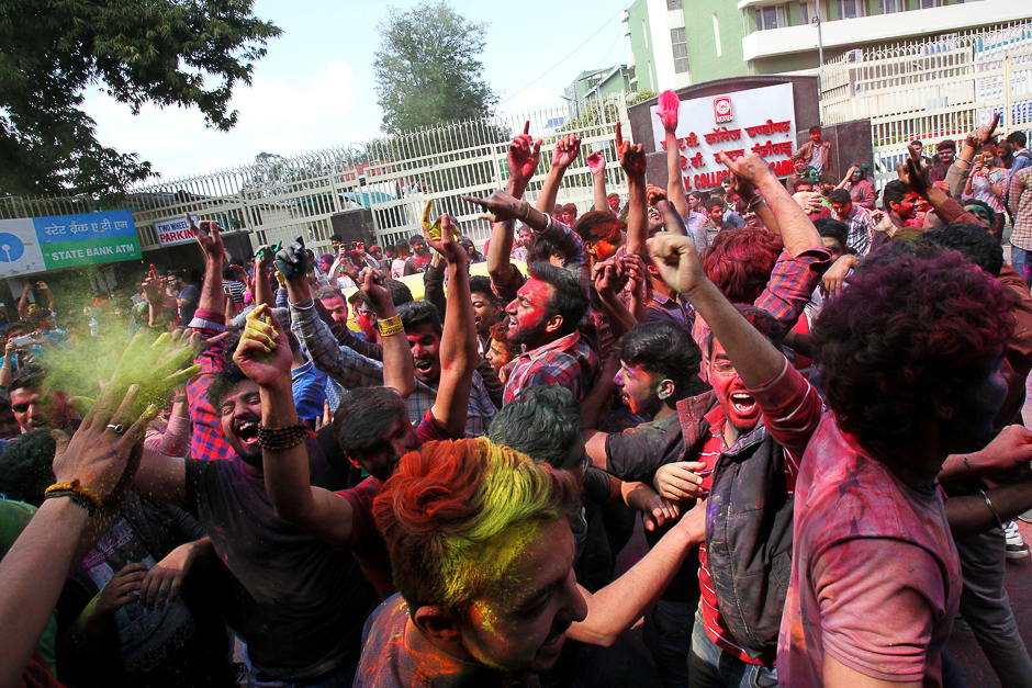 Boys smear each other with colours, Kolkata, India. PHOTO: REUTERS