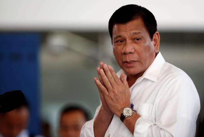 Philippine President Rodrigo Duterte speaks during a news conference before he departs for a visit to Thailand and Malaysia at the Ninoy Aquino International airport in Paranaque, Metro Manila in the Philippines. PHOTO: REUTERS