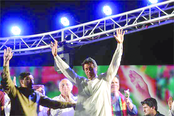 Imran Khan waves at the crowd before addressing the public gathering in Dadu. PHOTO: ONLINE
