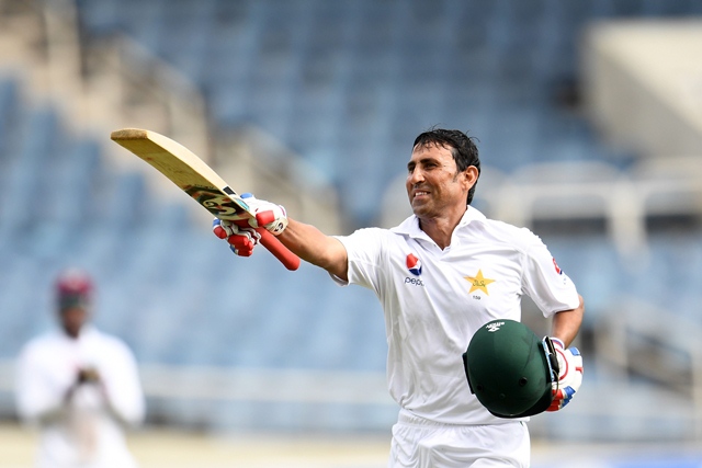 Younis Khan celebrates after reaching his 10,000th run in Test matches, on day three of the first Test match between West Indies and Pakistan. PHOTO:AFP