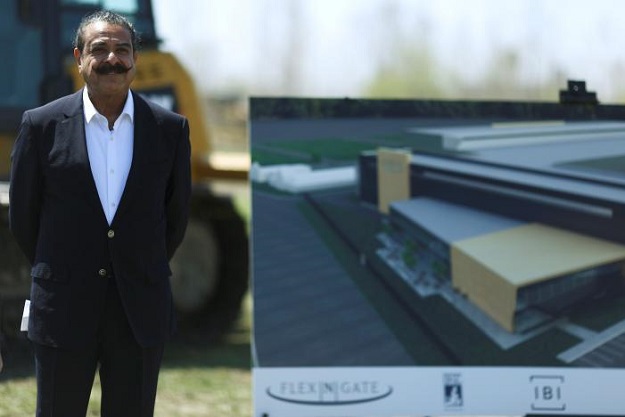 Owner and businessman Shahid Khan, stands alongside an artist's rendering of the Flex-N-Gate manufacturing facility during a ground breaking ceremony at the site in the I-94 Industrial Park in Detroit, Michigan, US, April 24, 2017.  PHOTO: REUTERS