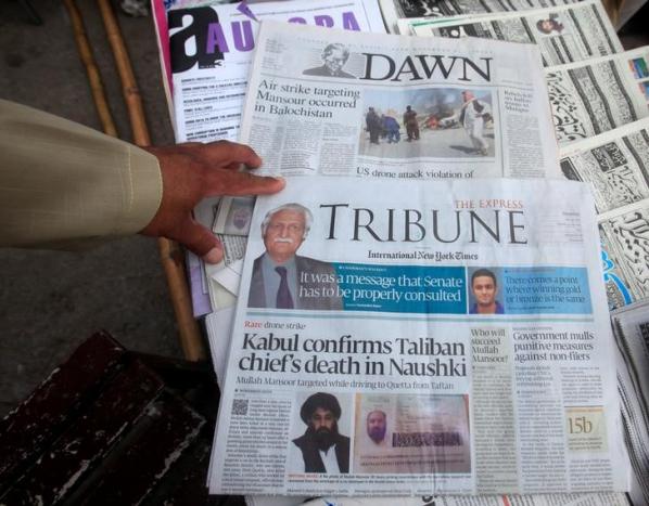 Newspapers containing news about Afghan Taliban leader Mullah Akhtar Mansour are on display at a stall in Peshawar, Pakistan, May 23, 2016.  PHOTO: REUTERS