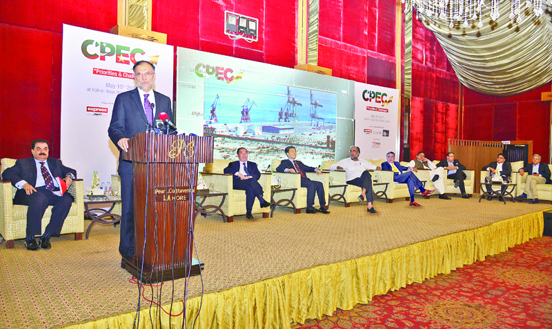 Planning Minister Ahsan Iqbal addresses a seminar on CPEC organised by Express Media Group in Lahore. PHOTO: WASEEM NIAZ / EXPRESS