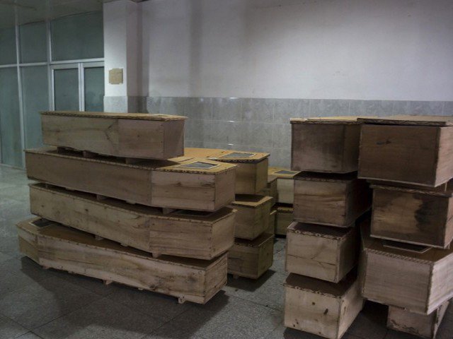 Village in Naushero Feroze receives nine caskets. PHOTO: REUTERS