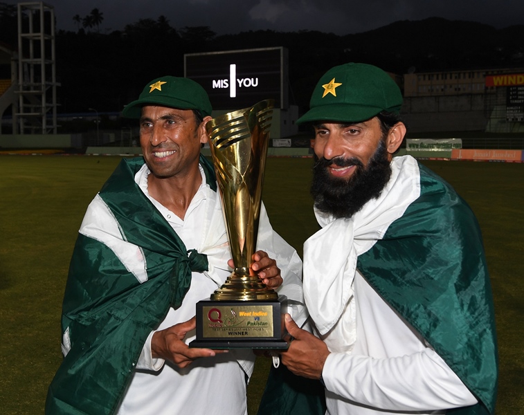Retiring Pakistan cricket team members Younis Khan (L) and captain Misbah-ul-Haq (R) celebrate with the series trophy  after winning the final test match and the series 2-1 against the West Indies at the Windsor Park Stadium in Roseau, Dominica on May 14, 2017.
PHOTO: AFP