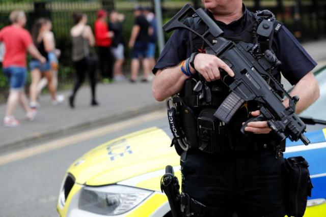 An armed policeman is seen outside the Lancashire County Cricket Club, Emirates Old Trafford, in Manchester, Britain May 27, 2017. PHOTO: REUTERS