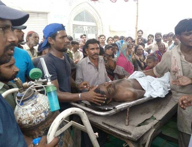 Ifran Masih's family and community members staged a sit-along with his body on the inter-district road connecting Umerkot. PHOTO: Twitter