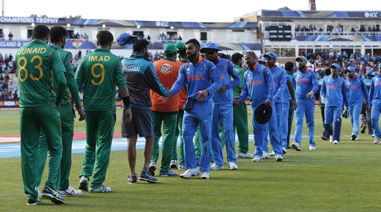 Players shake hands at the end of the match. PHOTO: REUTERS