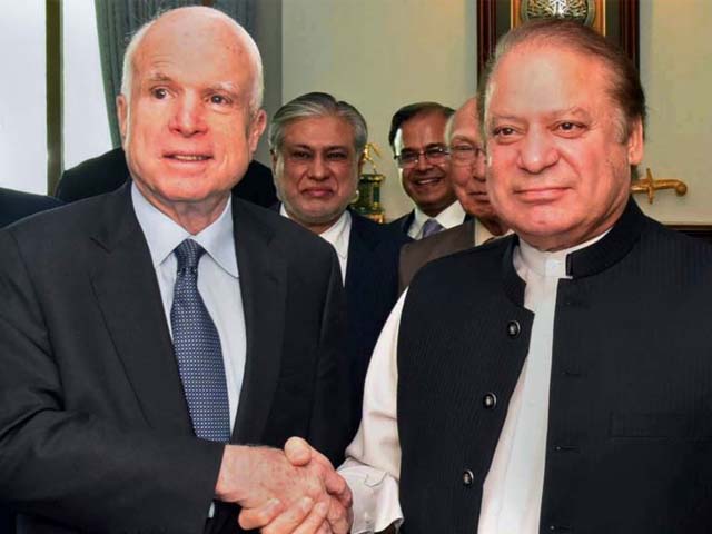 US Senator John McCain shakes hand with Pakistani Prime Minister Nawaz Sharif at the Prime Minister House in Islamabad on July 3, 2017.
PHOTO: AFP