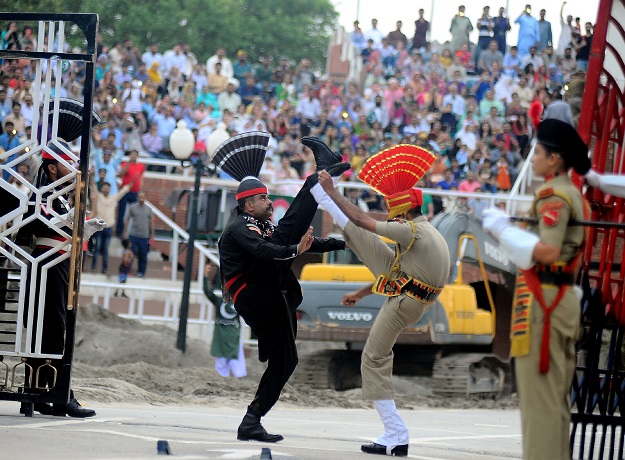 Indian and Pakistani border guards take part in the nightly ceremony at the India-Pakistan border in Wagah. PHOTO: AFP