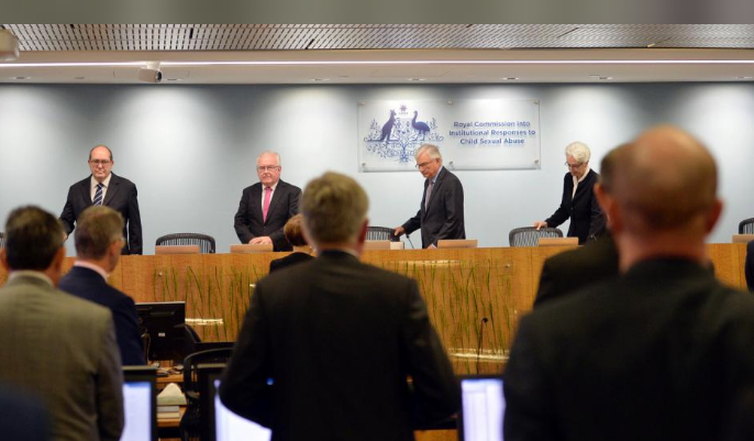 Officials from the Royal Commission into Institutional Responses to Child Sexual Abuse arrive on the opening day of their public hearing. PHOTO: REUTERS