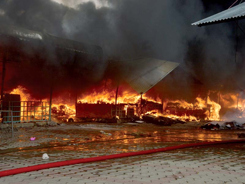 Fire engulfed the Weekly Bazaar in Sector H-9. PHOTO: MUDASSAR RAJA/EXPRESS/AGENCIES