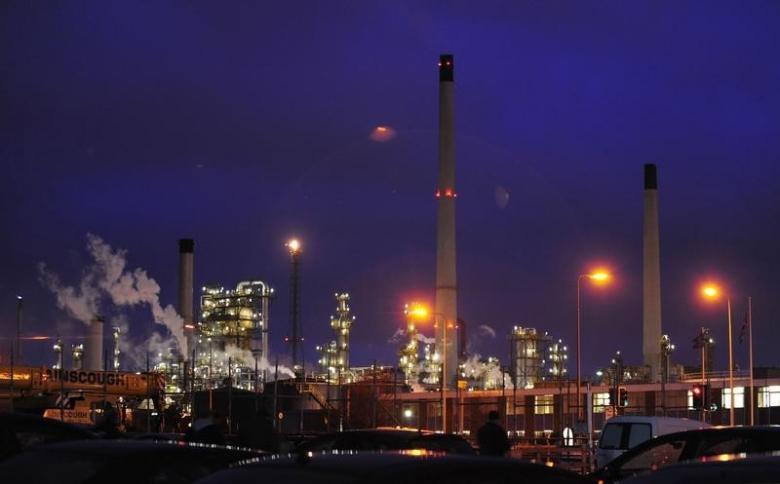Lights shine within an oil refinery. PHOTO: REUTERS