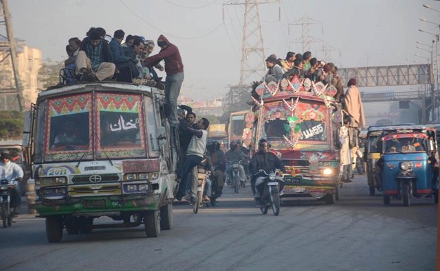 Due to the chronic lack of public transport passengers are often forced to climb atop buses. PHOTO: FILE