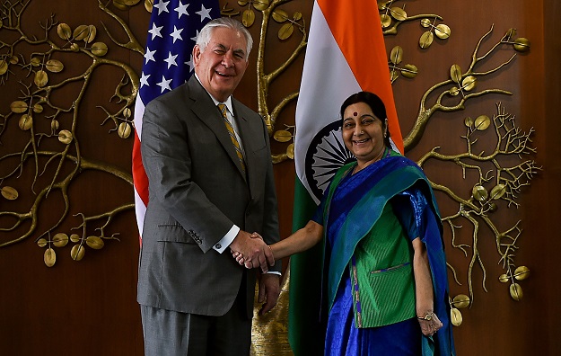 Indian Foreign Minister Sushma Swaraj (R) shakes hand with US Secretary of State Rex Tillerson before a meeting in New Delhi on October 25, 2017. PHOTO: AFP
