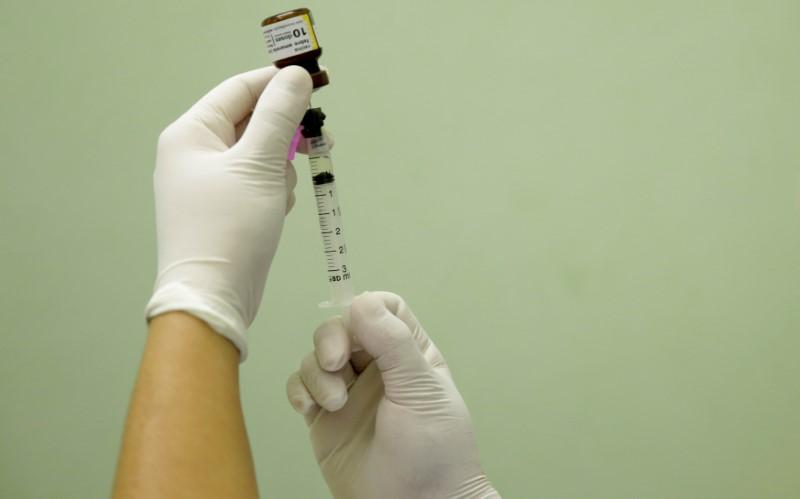 A health agent prepares a vaccine. PHOTO: REUTERS