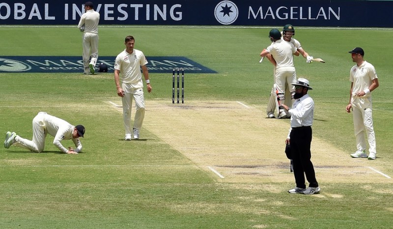 Australia's batsman Cameron Bancroft and  David Warner (2nd R) celebrate victory in the first cricket Ashes Test between England and Australia in Brisbane on November 27, 2017. PHOTO: AFP