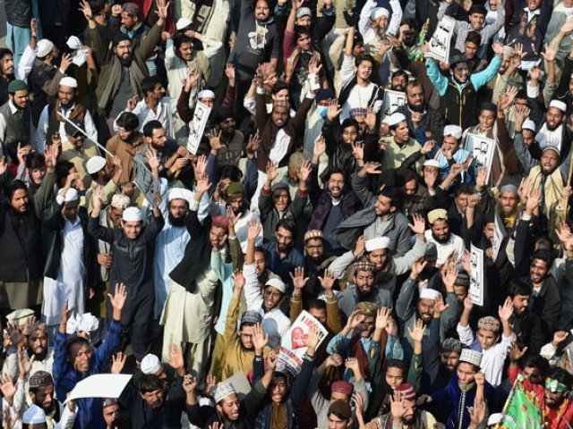 Protesters shout slogans against government during a protest in Lahore on November 25, 2017. PHOTO: AFP