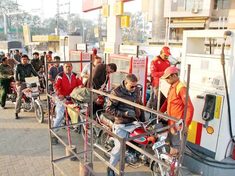 Motorcyclists line up at a petrol station. PHOTO: ABID NAWAZ/EXPRESS