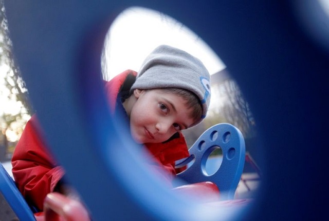 Seven-year-old Aron, who was born with epilepsy, can now join the fun on specially built equipment in some 30 Budapest playgrounds
PHOTO: AFP