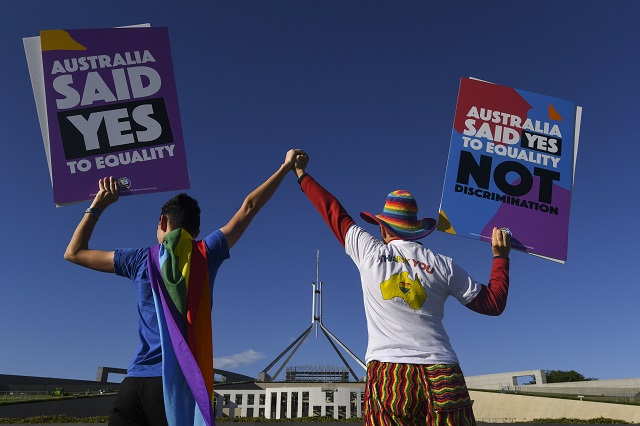 Same-sex marriage campaigners pose for pictures during an equality rally outside Parliament House in Canberra December 7, 2017. 
Photo via REUTERS