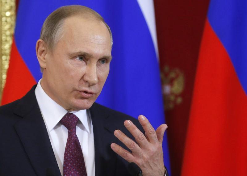 Russia spent more than four per cent of GDP on its military last year, but Putin said this share will decrease in the future.PHOTO:REUTERS
