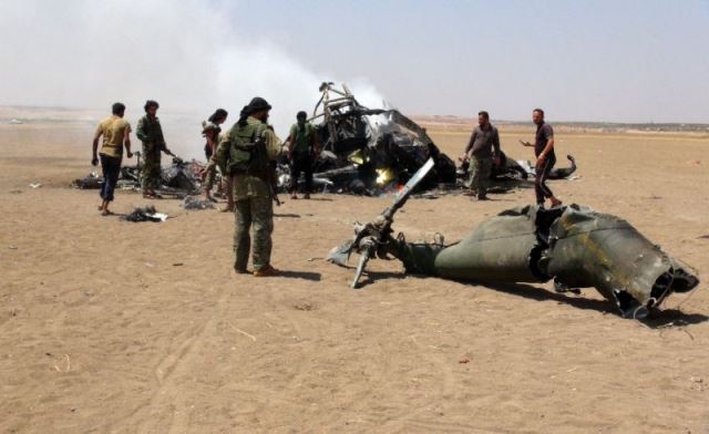 The Mi-24 military helicopter had tripped over power line wires and crashed while escorting a convoy. PHOTO: AFP
