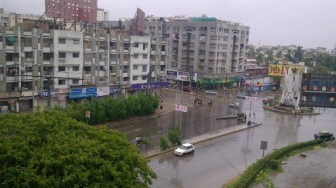 A view of deserted Shaheed-e-Millat road in the afternoon. PHOTO: SUHAIB JALIS AHMED