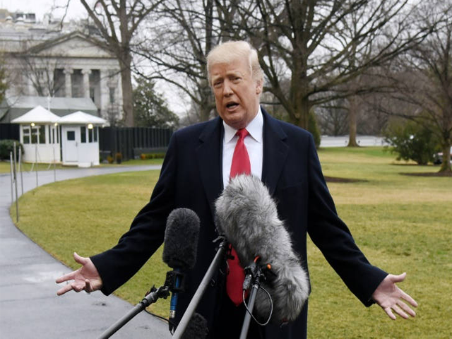 President Donald Trump said a deputy who failed to intervene during the Florida school shooting did a "poor job" or was a " coward". PHOTO: AFP